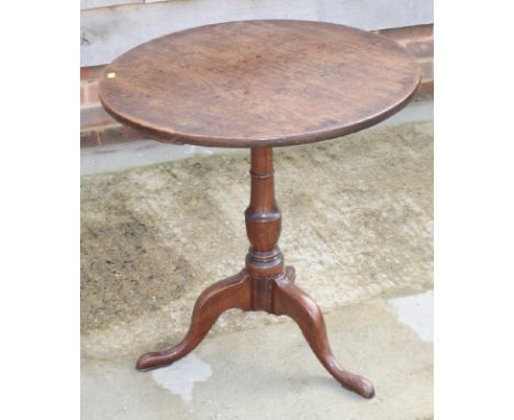 A George III mahogany circular occasional table, on vase turned stem and tripod base, 35" dia