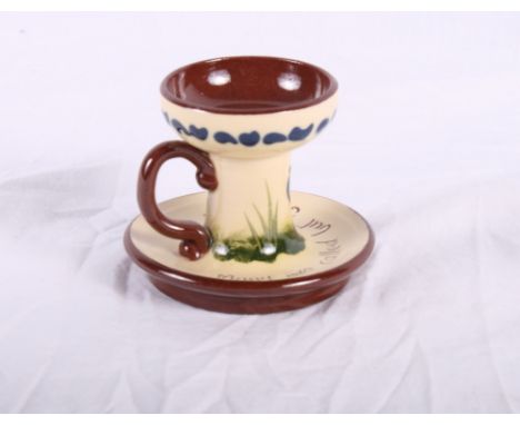 A Torquay Longpark pottery inkstand with inkwell, four candlesticks, taper stick, a two-handled vase, a baby's plate, etc, mo