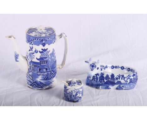A 19th Century Davenport Willow pattern drainer, a Spode Willow pattern tea cup and matching tea bowl, a Willow pattern two-h