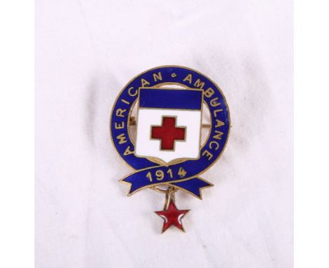 A gilt metal and enamel "AMERICAN AMBULANCE 1914" badge