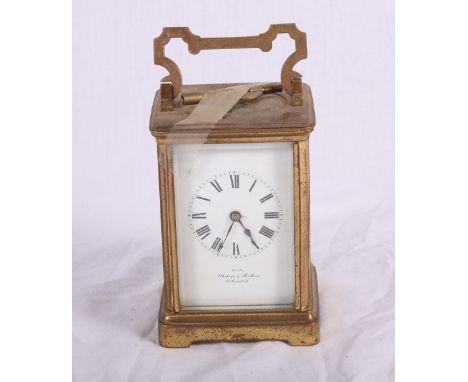 A brass cased carriage clock with white enamel dial retailed by Alstons & Hallam, Cornhill