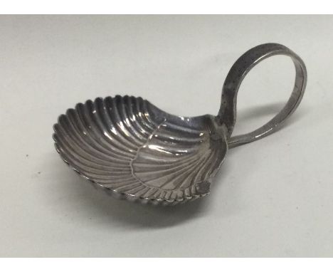 A George III silver caddy spoon with fluted bowl. Sheffield circa1800. Approx. 9 grams. Est. £30 - £50.