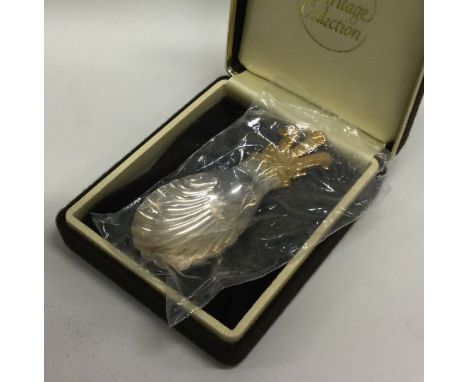 OF ROYAL INTEREST: A rare cased silver gilt caddy spoon decorated with The Prince of Wales Feathers and inscribed with the mo