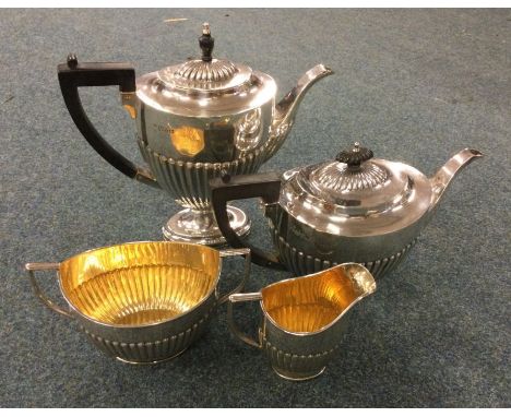 CHESTER: A good silver three piece silver half fluted tea service with gilt interior. 1913. Approx. 1902 grams. Est. £1000 - 