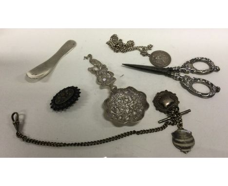 A pierced silver caddy spoon etc. Approx. 99 grams. Est. £20 - £30.