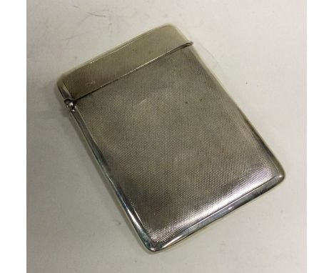 ASPREY &amp; CO: A silver engine turned card case. Chester 1924. Approx. 80 grams. Est. £120 - £150.