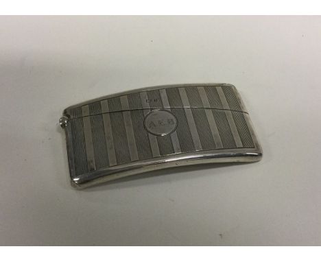 A slim shaped silver card case with engine turned decoration. Birmingham. Approx. 47 grams. Est. £20 - £30.