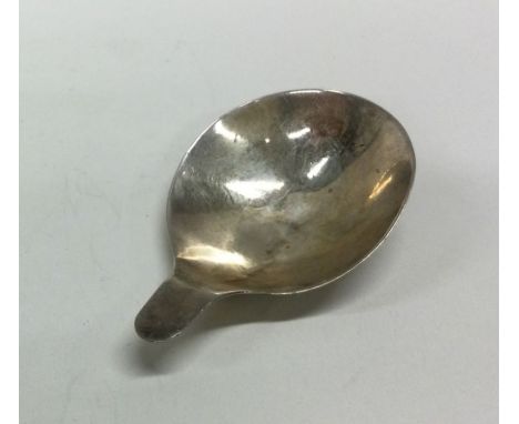 A silver caddy spoon with bright cut handle, possibly early 19th Century. Apparently unmarked. Approx. 6 grams. Est. £20 - £3