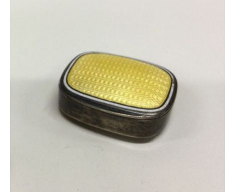 A silver and yellow enamel box. By Marius Hammer. Approx. 32 grams. Est. £80 - £120.