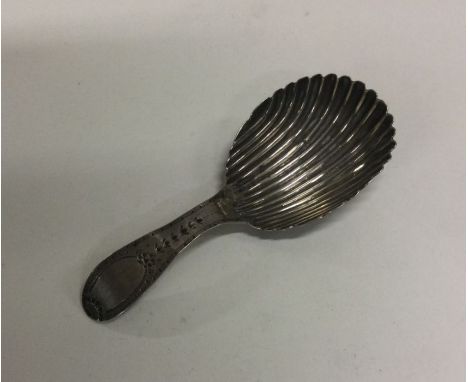 A George III silver caddy spoon. London 1813. Approx. 12 grams. Est. £30 - £50.