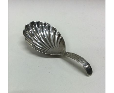 A William IV silver caddy spoon with fluted bowl. London 1835. Approx. 11 grams. Est. £30 - £50.