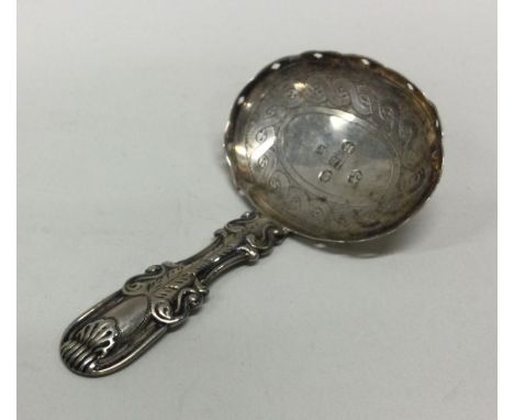 A George III silver caddy spoon with shell patterned handle. London 1811. By George Wintle. Approx. 13 grams. Est. £30 - £50.