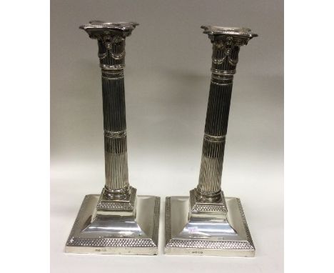 A fine pair of Victorian silver Corinthian column candlesticks. London 1880. By Henry Wilkinson &amp; Co. Approx. 2300 grams.