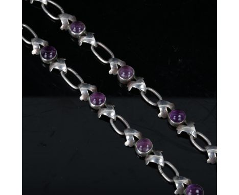 A Mexican sterling silver and cabochon amethyst necklace, maker's mark JE, necklace length 42cm, 27.6gNo damage, no broken li