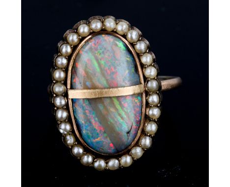 An Antique opal and pearl oval cluster ring, set with oval cabochon opal and split-pearls, setting height 21.7mm, size M, 3.2