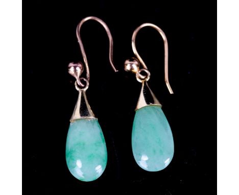 A pair of jade drop earrings, unmarked yellow metal settings with teardrop jade and shepherd hook fittings, earring height ex