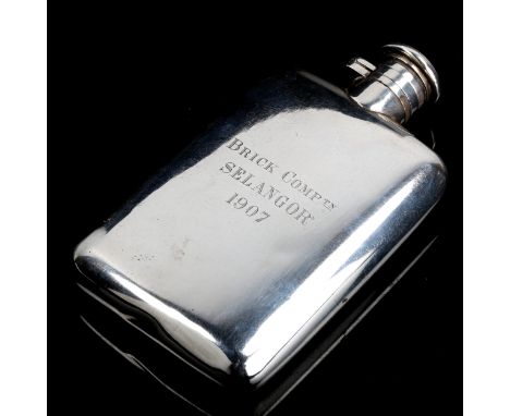 An early 20th century Chinese export curved silver hip flask, with bayonet cap and inscription for Brick Comptn Selangor 1907