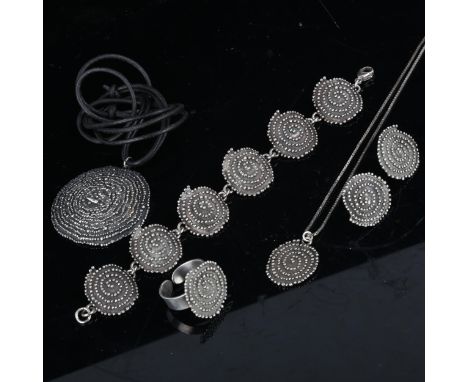 A Scandinavian sterling silver spiral pattern demi-parure, comprising 2 x pendant necklaces, bracelet, ring and pair of stud 