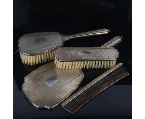 An Elizabeth II silver 4-piece dressing table set, comprising hand mirror, hair brush, clothes brush and comb, engine turned 