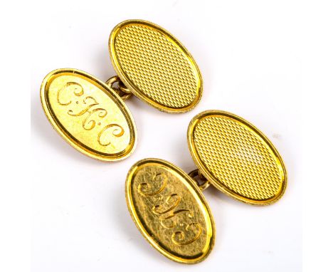 A pair of mid-20th century 18ct gold oval cufflinks, engine turned decoration, maker's marks D&F, hallmarks Birmingham 1967, 