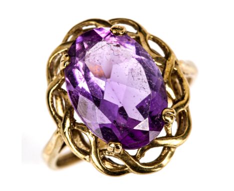 A modern 9ct gold amethyst dress ring, openwork settings with oval mixed-cut amethyst, setting height 18.7mm, size O, 3.5gNo 