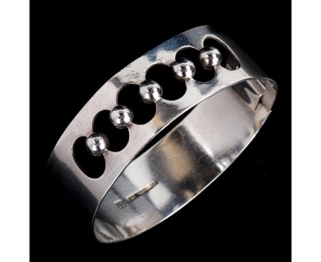 KAUNIS KORU - a Vintage Finnish silver torque bangle, with openwork bead design, hallmarks Helsinki 1968, band width 19.7mm, 