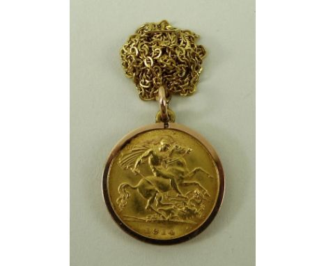 A George V half sovereign, 1914, in a mount with 9ct gold chain, 6.6g total.