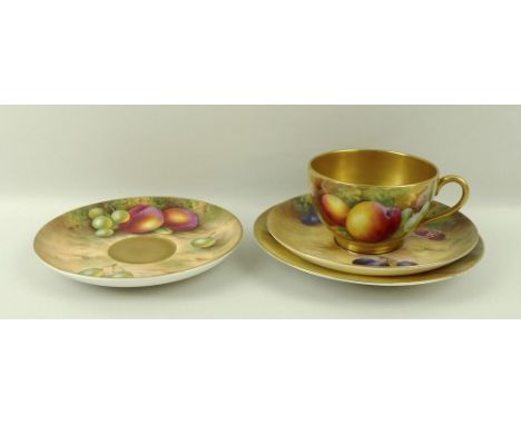 A Royal Worcester trio comprising tea cup, saucer and plate, painted with plums, raspberries and grapes, and signed N. H. Pri
