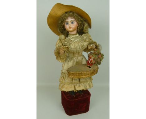 A Jumeau bisque socket head automaton doll 'Girl with Surprise Basket', by Leopold Lambert, circa 1890, marked to the back of