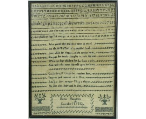 An embroidered cross stitch sampler, dated December 18th 1832, monochromatic, sewn by Hester Humphries, with typical alphabet