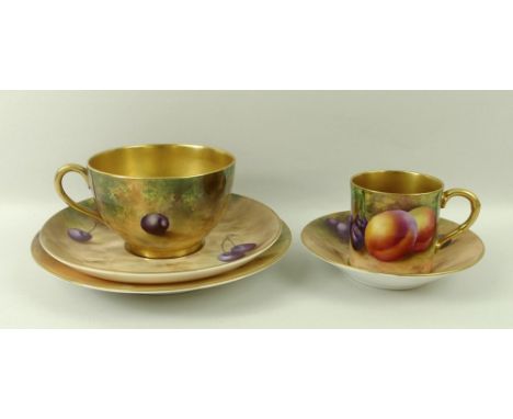 A Royal Worcester trio, comprising tea cup, saucer and plate, decorated with plums and cherries, signed by E. Townsend, Mosel
