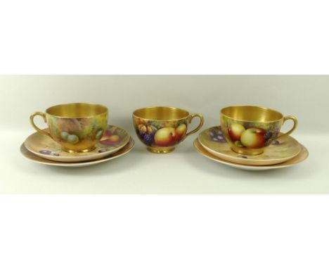 A Royal Worcester trio, comprising tea cup, saucer and plate, signed H Aynton and Moseley, and another similar, signed H H Pr
