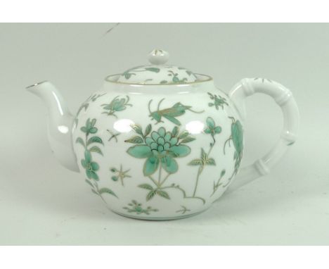 A Chinese, Hong Kong, part dinner and tea service, in white ground decorated with green and gold carnelians and crickets, sta