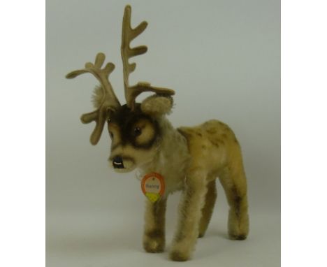 A Steiff Renny Reindeer, circa 1960, mohair, glass eyes, wired antlers, original paper tag 'Steiff-Original-Marke, Renny', 25