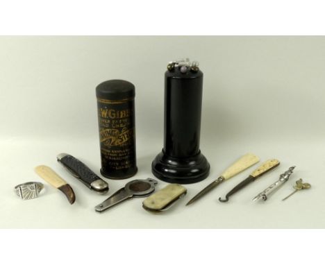 An ebony hat pin pillar with eight hat pins, a silver signet ring, size X, silver Celtic brooch, a bone handled button hook, 