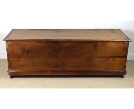 A large Victorian pine blanket chest, raised on four ceramic castors, 159 by 55 by 54cm high.