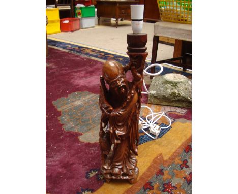 A Japanese served hardwood table lamp. 