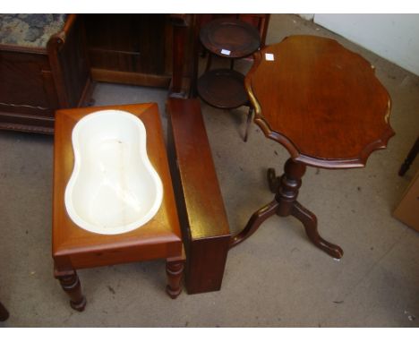 An early Victorian mahogany bidet footstool, the lift off top enclosing original ceramic liner on turned legs together with a