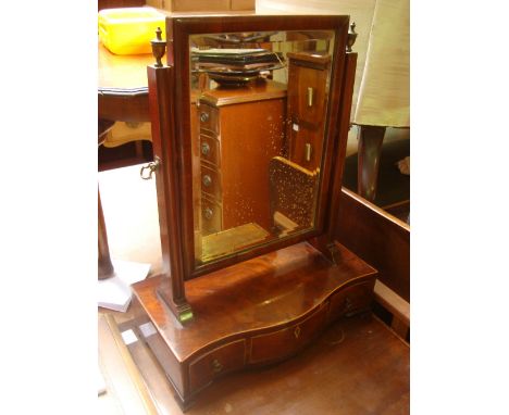 A George III mahogany swing toilet mirror, the rectangular bevelled plate on moulded uprights above a serpentine fronted box 
