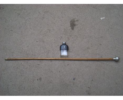 A Royal Cheshire Regiment swagger stick with a small leather bound flask. 