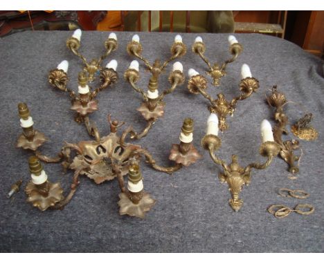 A gilt brass hanging light, six branches with putti and six twin branch gilt wall light.