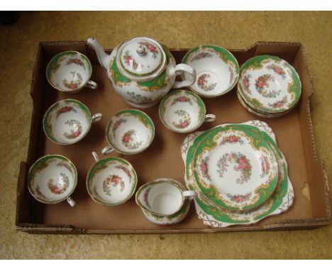 A Tuscan 'Naples' complete tea service comprising six cups, six saucers, six plates, tea pot, sandwich plate, milk jug and su