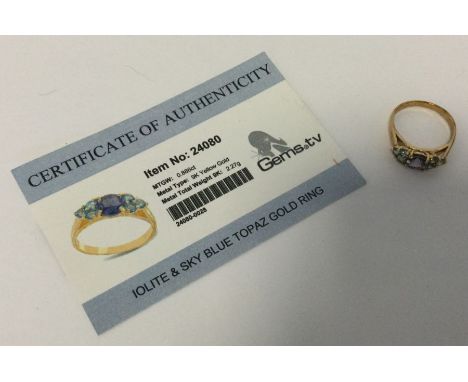 An iolite and blue topaz ring set in 9 carat. Approx. 2.27 grams. Est. £25 - £35.
