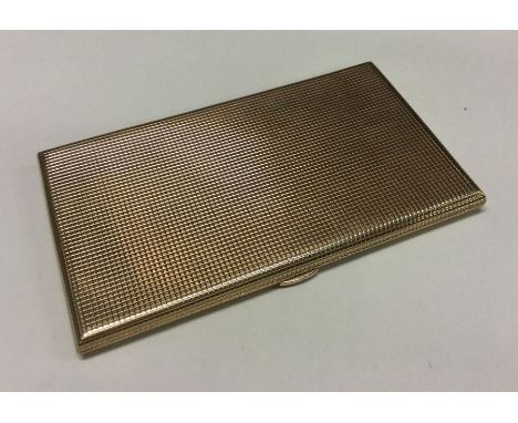 A heavy 9 carat engine turned cigarette box. Approx. 163 grams. Est. £1100 - £1100.