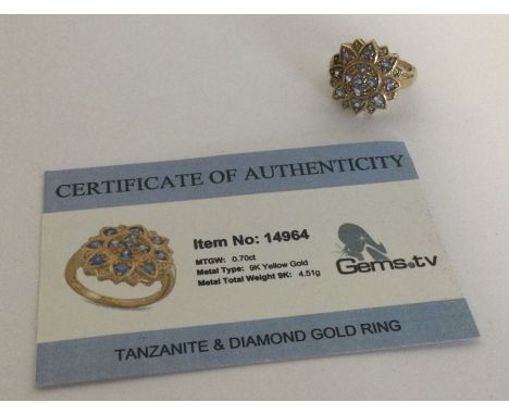 A tanzanite and diamond ring set in 9 carat. Approx. 4.51 grams. Est. £25 - £35.