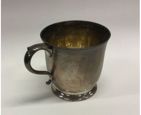 A fine quality Victorian silver christening cup with engine turned decoration. London. By Barnards. Approx. 271 grams. Est. £