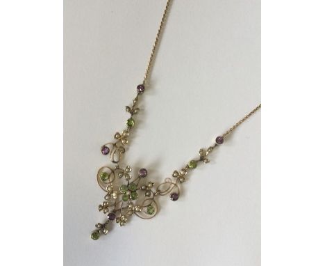 SUFFRAGETTE: A good 15 carat gold necklace attractively decorated with scrolls and flowers to ring clasp. Approx. 10 grams. E