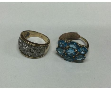 A 9 carat diamond mounted ring together with one other. Approx. 10 grams. Est. £70 - £80.