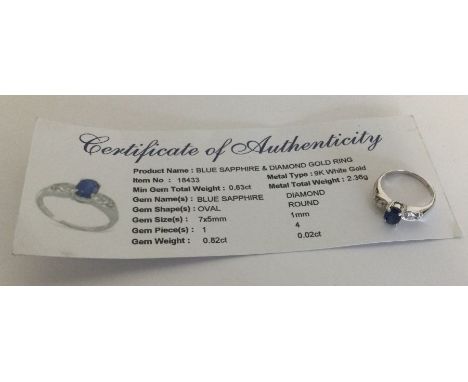 A sapphire and diamond ring set in 9 carat white gold. Approx. 2.36 grams. Est. £25 - £35.