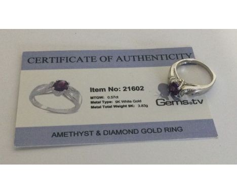 An amethyst and diamond ring set in 9 carat white gold. Approx. 3.83 grams. Est. £25 - £35.